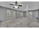 Enclosed lanai with two ceiling fans and sliding glass doors at 20995 Sw 93Rd Lane Rd, Dunnellon, FL 34431