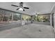Large screened patio with ceiling fans overlooking the back yard at 20995 Sw 93Rd Lane Rd, Dunnellon, FL 34431