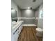 Modern bathroom with double vanity and stylish tiled walk-in shower at 36702 Calhoun Rd, Eustis, FL 32736