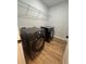 Laundry room features modern washer and dryer, plus wire shelf at 36702 Calhoun Rd, Eustis, FL 32736