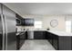 Modern kitchen with stainless steel appliances, white countertops, and dark cabinets for a stylish design at 4208 Cattail Marsh Dr, Lakeland, FL 33811