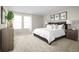 Cozy bedroom with two bright windows that showcase a comfortable bed and neutral tones at 4208 Cattail Marsh Dr, Lakeland, FL 33811