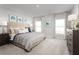Inviting bedroom with a comfortable bed, matching bedside tables and a large dresser at 4220 Cattail Marsh Dr, Lakeland, FL 33811