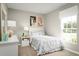 Bright bedroom features a charming llama-themed décor, a large window, and a cozy feel at 4220 Cattail Marsh Dr, Lakeland, FL 33811