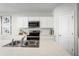 Well-appointed kitchen with stainless steel appliances, sleek countertops, and ample storage space, designed for culinary enthusiasts at 4220 Cattail Marsh Dr, Lakeland, FL 33811