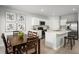 Open-concept living space integrating a modern kitchen, cozy breakfast bar, and dining area, perfect for Gathering gatherings and entertaining at 4220 Cattail Marsh Dr, Lakeland, FL 33811