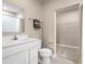 This is a bathroom with white cabinets, a white toilet, and a white tub/shower combo, as well as a walk-in closet at 4226 Cattail Marsh Dr, Lakeland, FL 33811