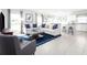 Bright open-concept living room with modern furniture, a large rug, and plenty of natural light at 4226 Cattail Marsh Dr, Lakeland, FL 33811
