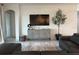 A stylish living room with modern decor, a large television, and comfortable seating at 1567 Lake Reserve Dr, Deland, FL 32724