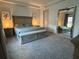 Cozy main bedroom featuring soft carpet, neutral decor, and a stylish mirror at 1567 Lake Reserve Dr, Deland, FL 32724