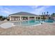 Resort-style pool with spacious deck, lounge chairs, and well-maintained landscaping for a relaxing experience at 1567 Lake Reserve Dr, Deland, FL 32724