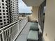 Private balcony with a comfy lounge chair overlooking the neighborhood at 1425 Ocean Shore Blvd # 402, Ormond Beach, FL 32176