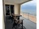 Balcony with seating area has gorgeous views of the ocean and the sandy beach at 1425 Ocean Shore Blvd # 402, Ormond Beach, FL 32176