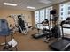 Spacious community gym featuring a variety of weight training and cardio equipment with natural lighting at 1425 Ocean Shore Blvd # 402, Ormond Beach, FL 32176