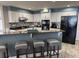 Well-equipped kitchen featuring sleek appliances, a breakfast bar with seating, and ample counter space at 1425 Ocean Shore Blvd # 402, Ormond Beach, FL 32176