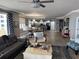 Comfortable living room showcasing stylish decor, tile floors, and an open layout connecting to the kitchen at 1425 Ocean Shore Blvd # 402, Ormond Beach, FL 32176