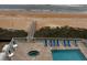 Overhead view of the pool, jacuzzi, beach access, and surrounding deck at 1425 Ocean Shore Blvd # 402, Ormond Beach, FL 32176