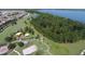 Community aerial view showcasing a park, playground, lake, walking trails, and lush landscaping at 3317 Grande Heron Dr, St Cloud, FL 34773