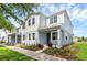Beautiful, new construction two-story townhome with a covered porch and professionally landscaped yard at 3323 Grande Heron Dr, St Cloud, FL 34773