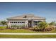 Charming single-story home with a well-manicured lawn, colorful landscaping, and a welcoming entrance at 1916 Quail Fields Cir, Winter Haven, FL 33884