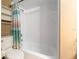 Bathroom area showcasing a tub with shower and a newer toilet, ready for use at 3200 Se 34Th St, Ocala, FL 34471