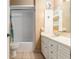 Bathroom vanity with decorative mirror, tub, and ample lighting to create a charming space at 3200 Se 34Th St, Ocala, FL 34471