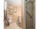 Bathroom featuring toilet, vanity, and shower with grab bar at 3200 Se 34Th St, Ocala, FL 34471
