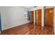 Bedroom with updated hard surface floors, closet space, and natural light from a window at 3200 Se 34Th St, Ocala, FL 34471
