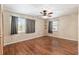 Bedroom with wood floors, ceiling fan, and windows at 3200 Se 34Th St, Ocala, FL 34471