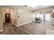 Open dining area with modern flooring, view into kitchen, and open access to entryway at 3200 Se 34Th St, Ocala, FL 34471