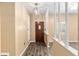 Warm entryway featuring a classic wood front door and decorative white columns enhancing the home's appeal at 3200 Se 34Th St, Ocala, FL 34471