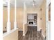 Welcoming entryway showcasing wood-look floors and a glimpse into the open living space with fireplace at 3200 Se 34Th St, Ocala, FL 34471