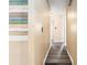 Hallway leading to bedrooms featuring wood-look floors and accent wall at 3200 Se 34Th St, Ocala, FL 34471