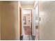 Hallway view with access to bedrooms and closet featuring hard surface floors throughout the home at 3200 Se 34Th St, Ocala, FL 34471