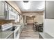 Kitchen with gray cabinets, modern white appliances, and view into open floor plan at 3200 Se 34Th St, Ocala, FL 34471
