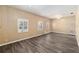 Bright living room featuring light walls, wood-look floors, and white windows that bring in natural light at 3200 Se 34Th St, Ocala, FL 34471