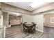 Open floor plan connects kitchen to living room, featuring brick fireplace and accent wall at 3200 Se 34Th St, Ocala, FL 34471