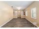 Bright living room featuring modern flooring, neutral walls, and large windows with plantation shutters at 3200 Se 34Th St, Ocala, FL 34471