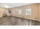 Open living space featuring wood-look flooring, neutral paint, and bright windows creating a welcoming atmosphere at 3200 Se 34Th St, Ocala, FL 34471