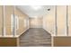 Spacious living room featuring multiple windows, neutral paint, and durable wood-look flooring at 3200 Se 34Th St, Ocala, FL 34471