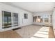 Enclosed patio with tiled floors, sliding glass doors, and multiple windows, ideal for relaxation and entertaining at 3200 Se 34Th St, Ocala, FL 34471