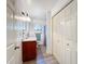 Bathroom features granite counters, and sleek fixtures at 4931 Tropicana Dr, Indian Lake Estates, FL 33855