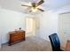 Cozy bedroom features a dresser, neutral paint, and carpeted floor at 4931 Tropicana Dr, Indian Lake Estates, FL 33855