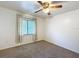 Minimalist bedroom with carpeted floor and a window at 4931 Tropicana Dr, Indian Lake Estates, FL 33855