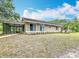 Cozy home with a screened porch, perfect for enjoying the outdoors in comfort at 4931 Tropicana Dr, Indian Lake Estates, FL 33855