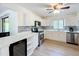 Bright kitchen features stainless steel appliances, white cabinetry, and a stylish countertop at 4931 Tropicana Dr, Indian Lake Estates, FL 33855