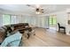 Spacious living room boasts abundant natural light and laminate floors at 4931 Tropicana Dr, Indian Lake Estates, FL 33855