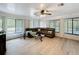Spacious living room boasts abundant natural light and laminate floors at 4931 Tropicana Dr, Indian Lake Estates, FL 33855