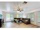 Spacious living room boasts abundant natural light and laminate floors at 4931 Tropicana Dr, Indian Lake Estates, FL 33855