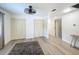 Clean living space with modern flooring, closet space and a contemporary ceiling fan at 4931 Tropicana Dr, Indian Lake Estates, FL 33855